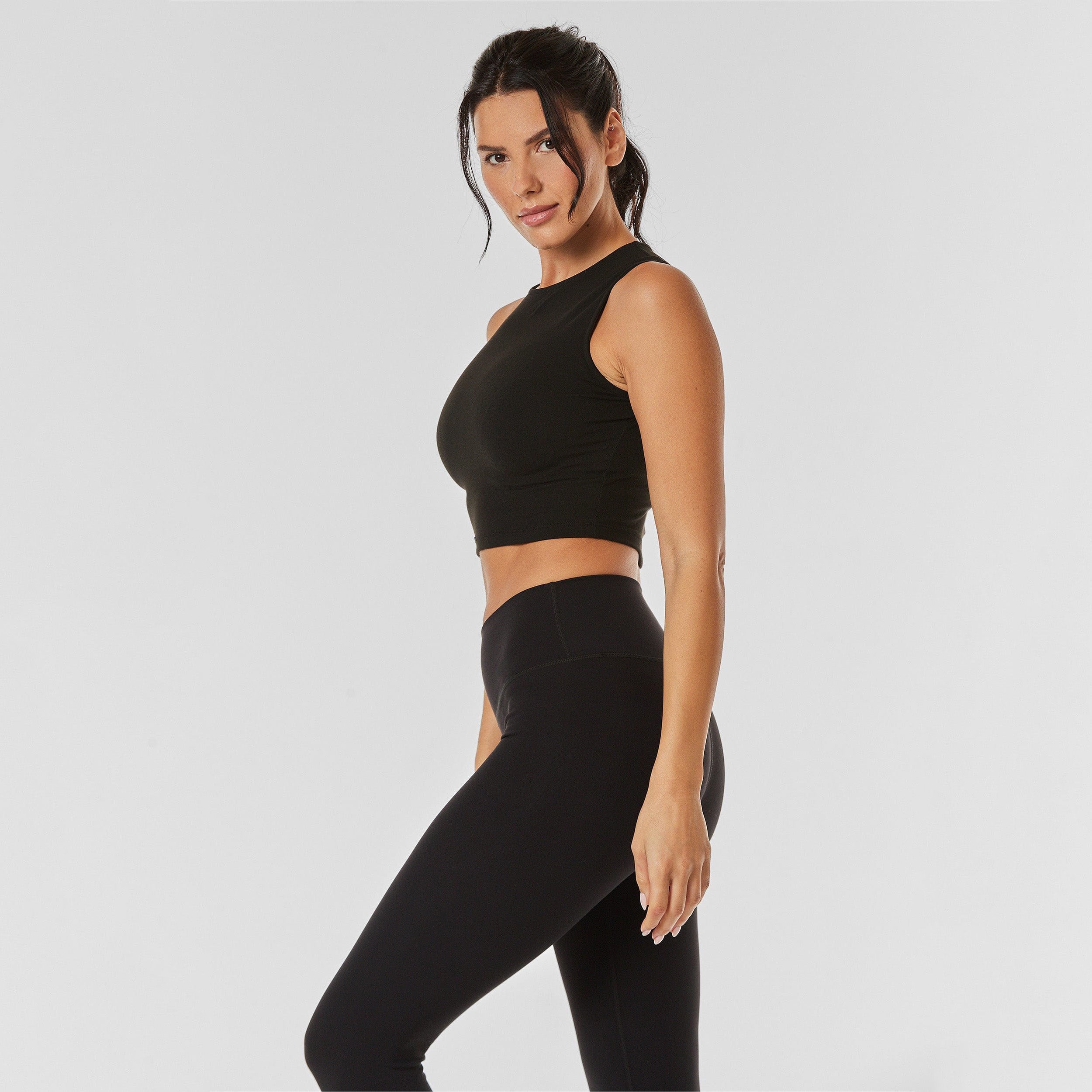 Side view of woman wearing black and matching leggings