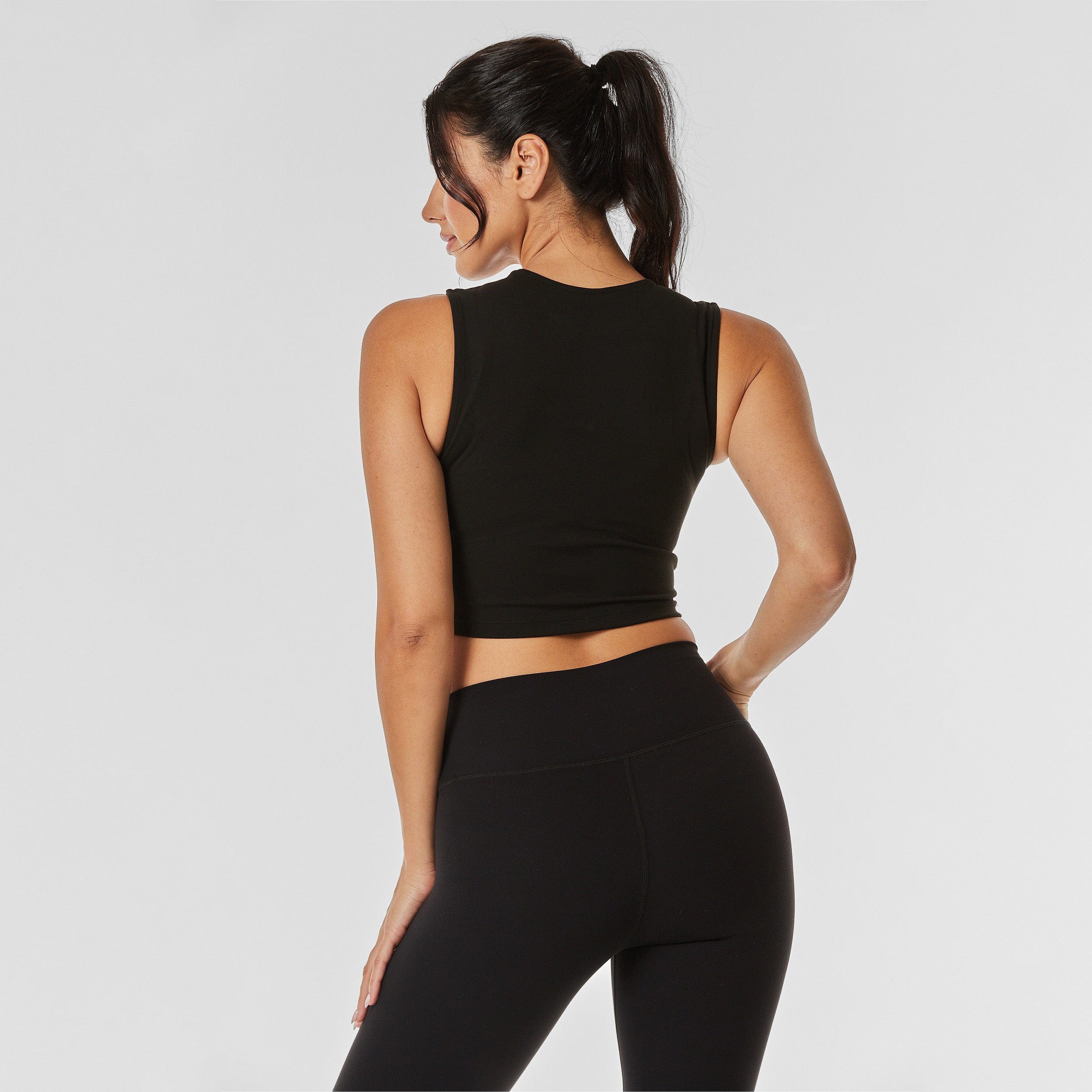 Rear view of woman wearing black and matching leggings