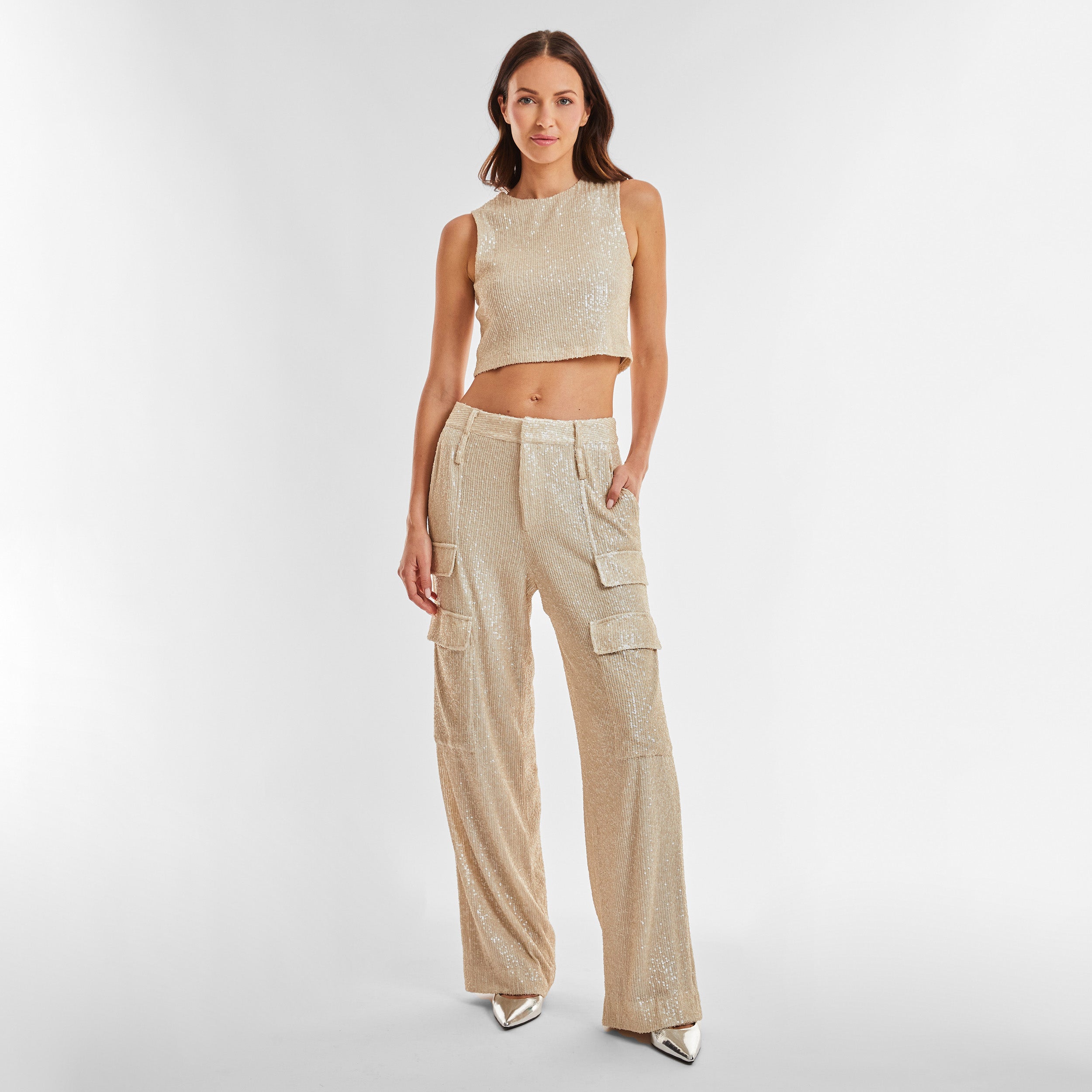 Full view of woman wearing Pearl Sequin Cargo Pant featuring Mid-rise with side pockets and cargo detail. 