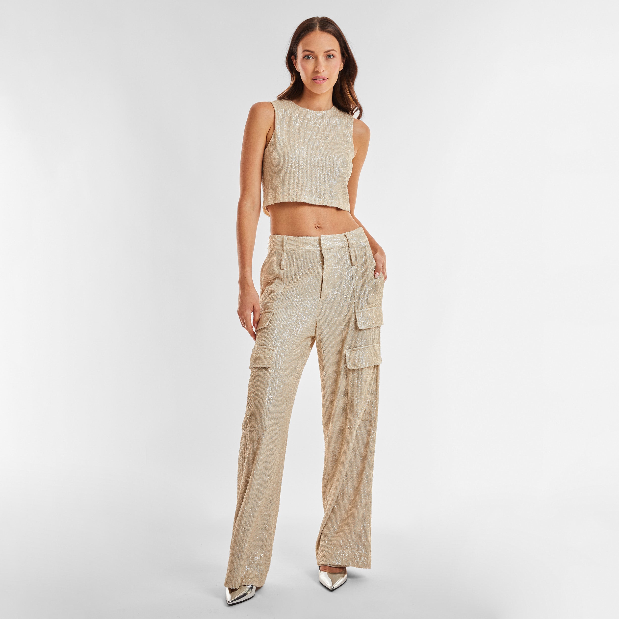 Full view of woman wearing Pearl Sequin Cargo Pant featuring Mid-rise with side pockets and cargo detail. 