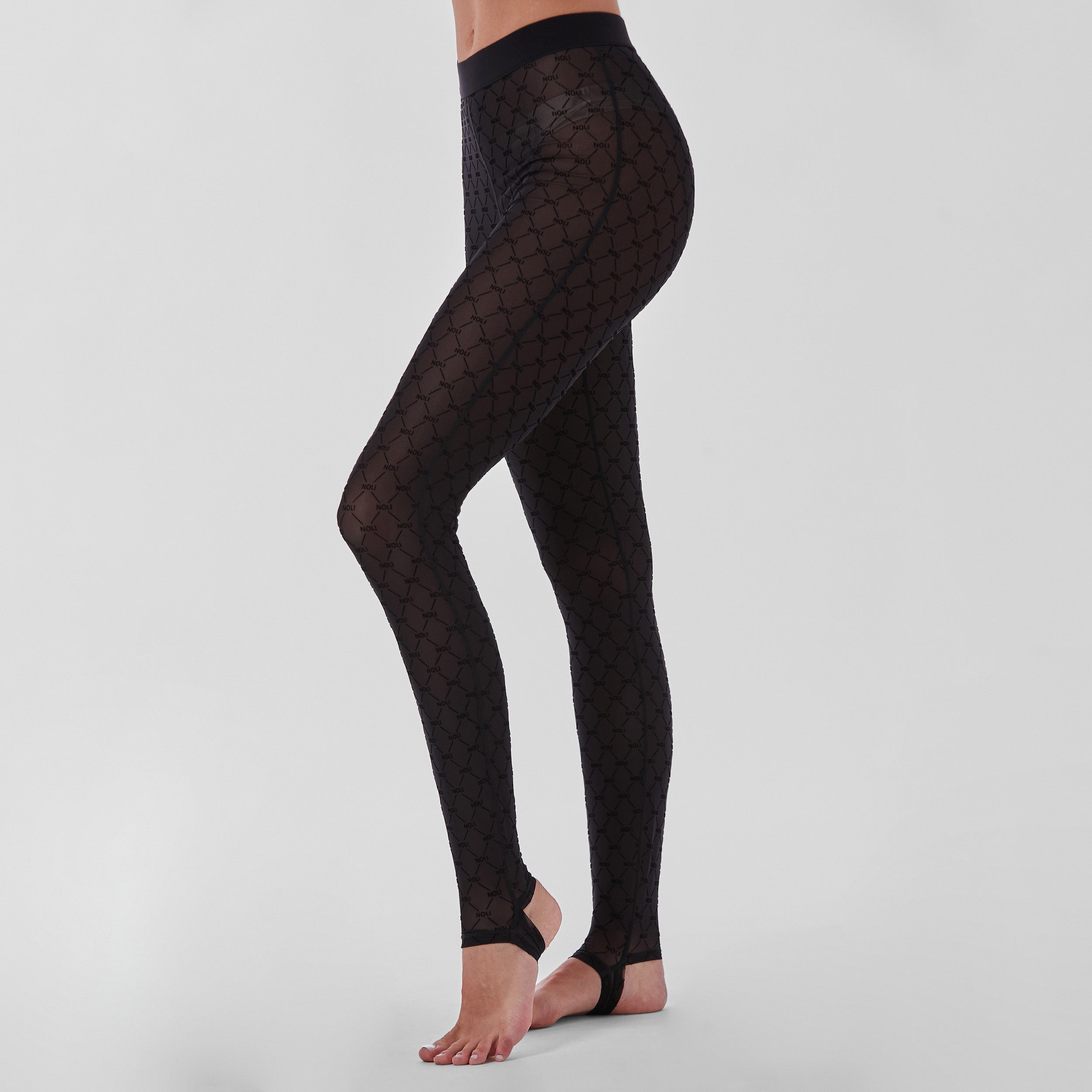 Side view of woman wearing tights featuring ultra-soft and comfortable NOLI monogram mesh, slip this four-way stretch mesh