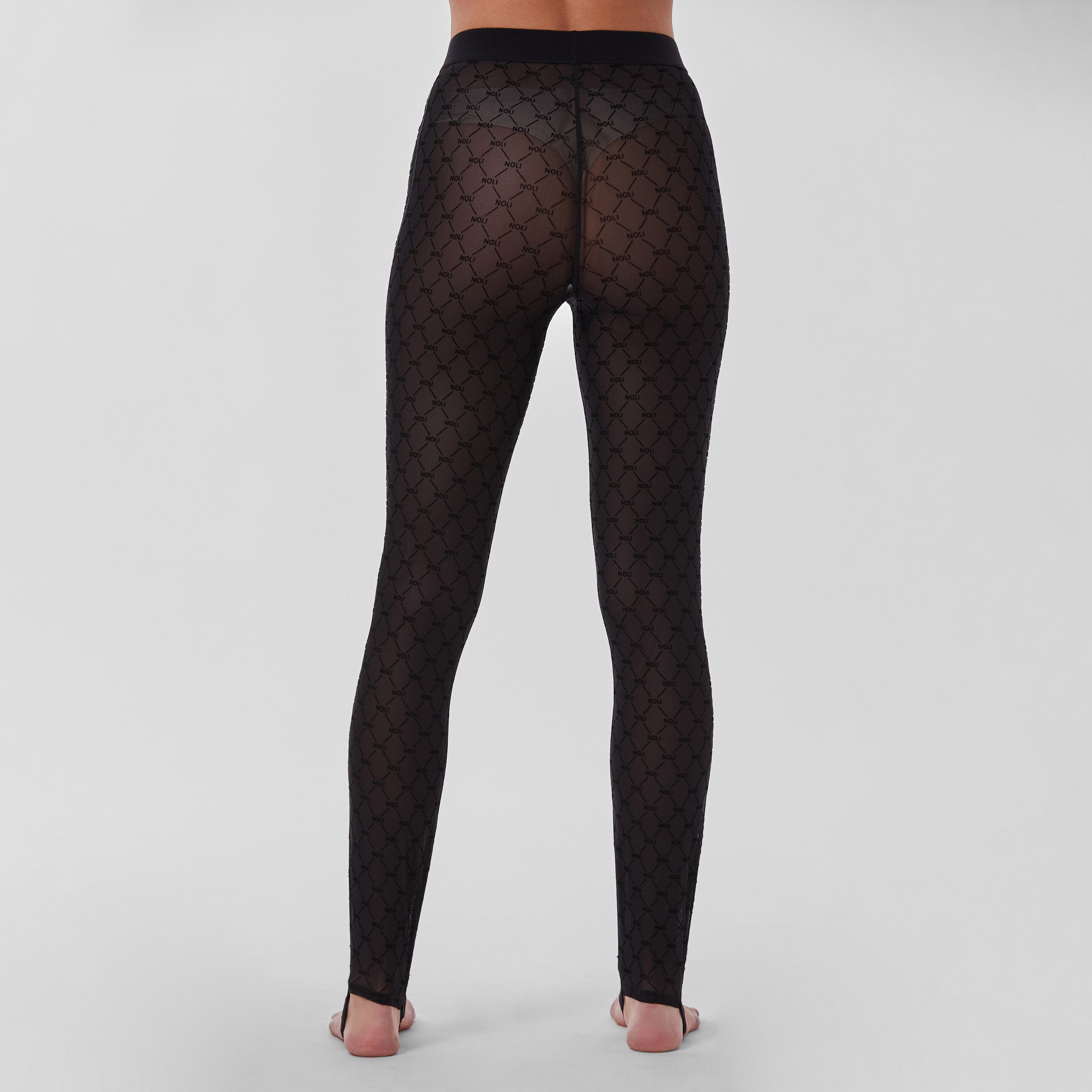 Rear view of woman wearing tights featuring ultra-soft and comfortable NOLI monogram mesh, slip this four-way stretch mesh