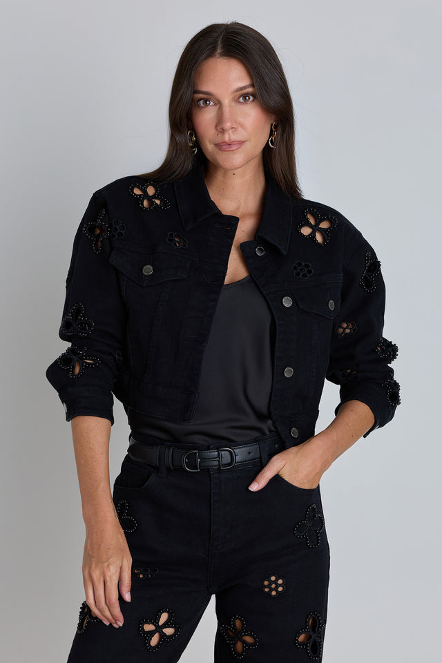 The Kaia Pearl Jean Jacket in black, a cropped denim jacket with pearl and bead floral embellishments