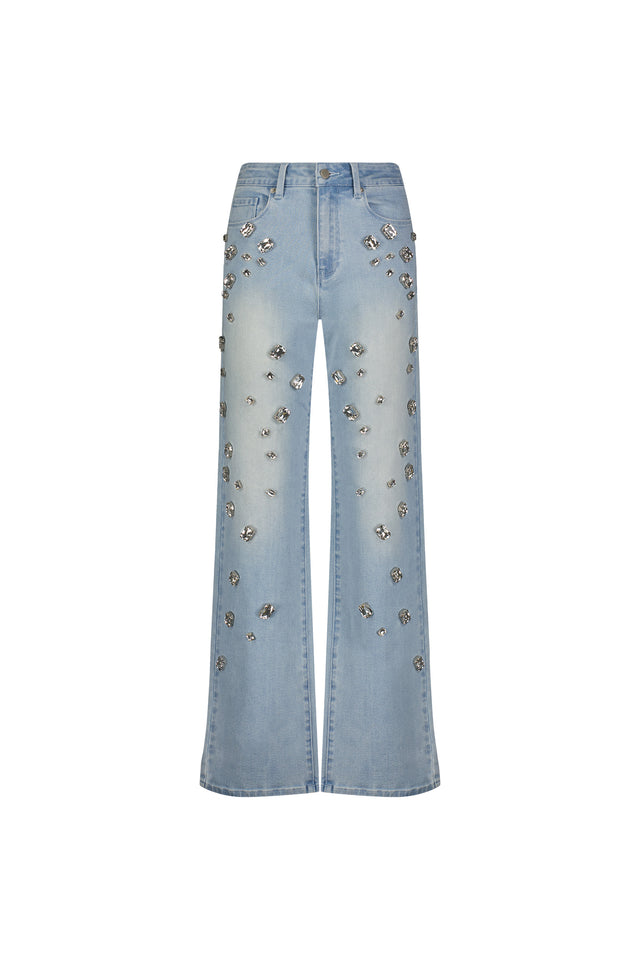 The Tara Crystal Jean - Light Blue is a pair of high-rise stretch denim jeans featuring silver floral embellishments on the front, shown against a white background.