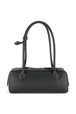 The Reese Leather Bag - Black is a rectangular structured handbag with two long handles and gold hardware, including a gold zipper closure. Its minimalist design and clean lines make it ideal for everyday use.