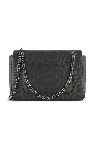 The Alessia Rose Embossed Leather Bag - Black showcases a delicate floral pattern and a sleek silver chain strap, crafted from quilted leather and featured against a white background.