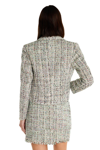 A woman with long brown hair is seen from behind, wearing the Gabrielle Double Breasted Tweed Blazer in Teal Multi, which features a tailored waist and textured finish. Her left arm is bent while her right arm hangs naturally.