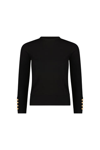 The Marcela Knit Top - Black is a fitted sweater featuring a crew neck and gold cuff buttons, shown against a plain white background.