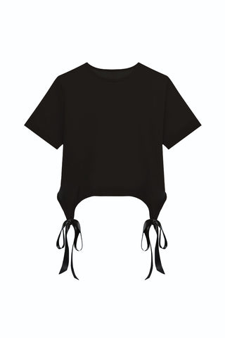 The Diana Satin Bow Shirt in black features a round neckline and two side ties at the hem, offering a gathered, adjustable look—ideal for stylish spring outfits.