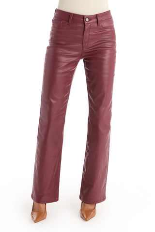 A person wearing Aria Coated Flare Jean in Merlot and pointed-toe brown heels, photographed from the waist down against a white background.