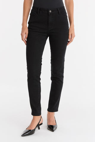 A person wearing Layla Skinny Jean - Black is shown from waist to feet, standing in heels against a plain white background.