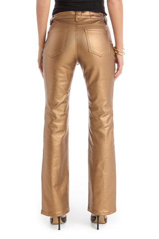 A person is shown from the back wearing Aria Coated Flare Jean - Gold Metallic with a high-rise fit, two back pockets, and black heels, standing against a white background.