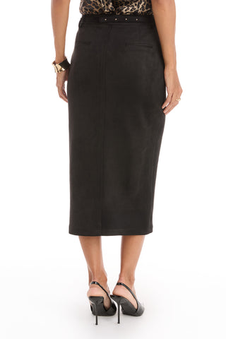 A woman faces away, wearing the Kendra Sueded Midi Skirt in black with a leopard print top, black high-heeled sandals, and a gold bracelet. The well-lit background is white.