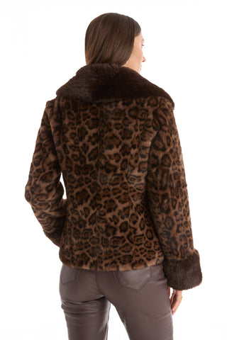 A woman is seen from behind wearing the Sydney Fur Trim Coat - Leopard, featuring a bold animal print with wide, dark brown collar and cuffs, paired with matching dark brown pants against a white background.