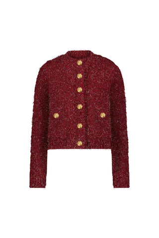 The Joana Knit Cardigan - Merlot features a textured deep red knit, padded shoulders, a round neckline, and six gold buttons in two vertical rows on the front.