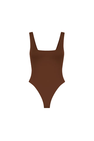 The Loren Bodysuit - Espresso is a brown one-piece swimsuit made from stretch fabric, featuring a square neckline and high-cut leg openings, shown against a plain white background.
