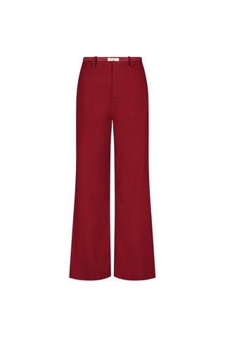 The Martina Belted Trouser in Merlot is a pair of high-waisted, flare leg pants in solid deep red, shown against a white background.