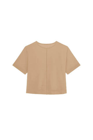 The Naya Suede T-Shirt - Cafe features a plain, short-sleeved beige design with a round neckline and vertical center seam. Displayed on a white background, it's perfect as a layering piece for effortless style.
