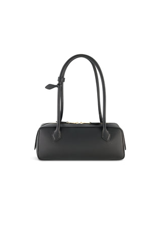 The Reese Leather Bag - Black features a structured silhouette, two long handles, minimalistic design, and gold hardware, displayed against a plain white background.