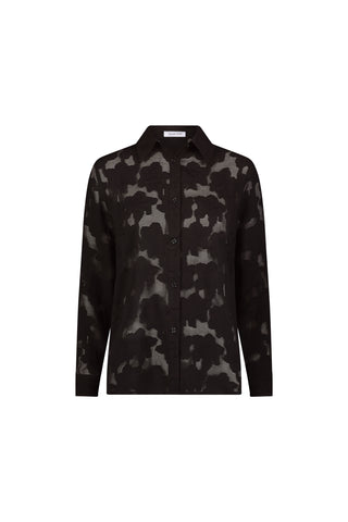 The Stelle Button Up - Black is a long-sleeve blouse with a black and dark gray camo pattern, pointed collar, and straight hem—ideal for layering. Shown on a white background.