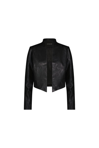 The Yasmin Leather Jacket - Black is a collarless, faux leather cropped jacket with long sleeves and a draped front, shown against a plain white background.