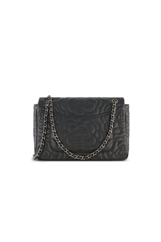 The Alessia Rose Embossed Leather Bag - Black features a rose-embossed design, black leather, and a sleek silver chain strap, shown against a white background.