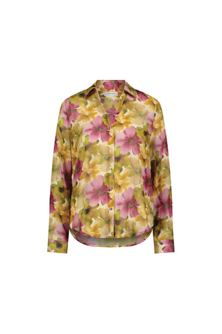 The Ana Chiffon Blouse - Floral Print is a long-sleeved, button-up top with a collar and a vibrant yellow, pink, and green floral pattern on a light background—ideal as an office blouse.