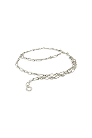 The Arden Chain Belt in silver features varying link sizes and a small circular clasp, shown coiled on a white background.