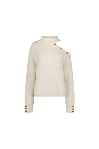 The Bridgette Button Sweater - Pearl is a modern ivory long-sleeve knit with a high neckline, gold buttons on one shoulder and cuffs, and an asymmetrical collar, shown against a white background.