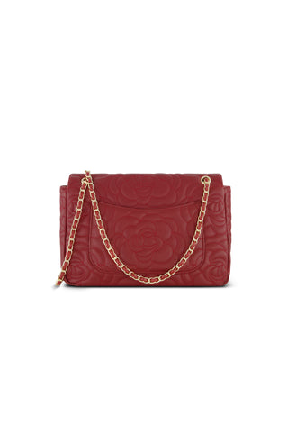The Alessia Rose Embossed Leather Bag in Merlot features quilted leather with rose patterns and a gold chain strap, shown against a white background.