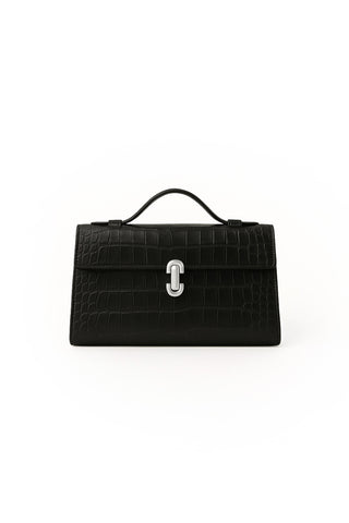 The Danica Croco Clutch - Black is crafted from crocodile-embossed leather with a top handle and silver clasp, shown elegantly on a plain white background.