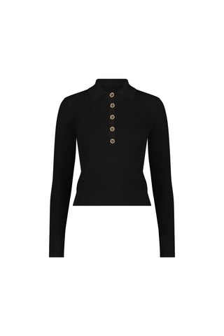 The Darla Rose Polo Shirt - Black features long sleeves, a collared neckline, five gold front buttons, and a fitted, slightly cropped silhouette, offering classic sophistication with its minimalist design.