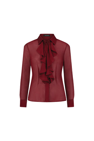 The Georgia Semi-Sheer Blouse - Burgundy is a long-sleeved, sheer blouse with modern tailoring, a collared neckline, and an eye-catching large ruffled bow down the front.