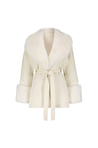 The Isabel Fur Trim Coat - White is an elegant, cream-colored belted coat with a wide, fluffy white faux fur collar and matching cuffs, shown on a white background.