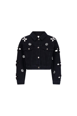 The Kaia Pearl Jean Jacket in black features a chic cropped silhouette, silver buttons, and cut-out flower designs with pearl and bead embellishments on the shoulders, chest, and sleeves.