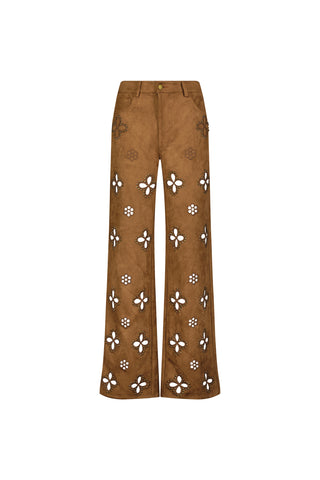 The Kaia Suede High Rise Jean - Cognac features stretch suede in brown, a straight-leg fit, high-rise waist, white floral cutouts with dotted accents, belt loops, front pockets, and a button closure.