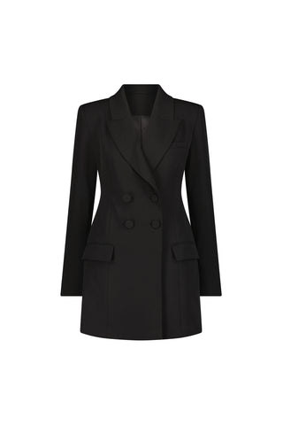 The Kira Blazer Dress - Black is a double-breasted dress featuring power shoulders, four front buttons, notched lapels, front flap pockets, and a tailored fit, shown on a white background.