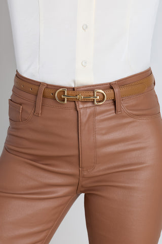 The Heritage Belt in mocha worn at the waist, showing the slim strap and gold horsebit buckle