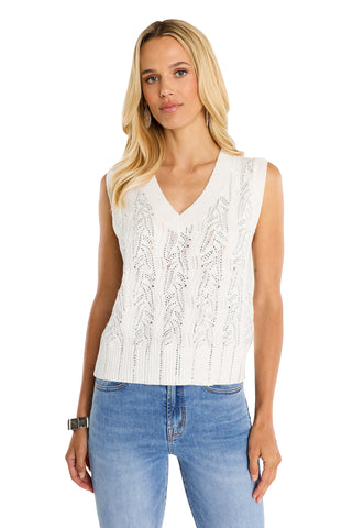 A woman with long blonde hair wears the Mikaela Crystal Knit Tank in white and light blue jeans, standing against a white background and looking at the camera with a neutral expression.