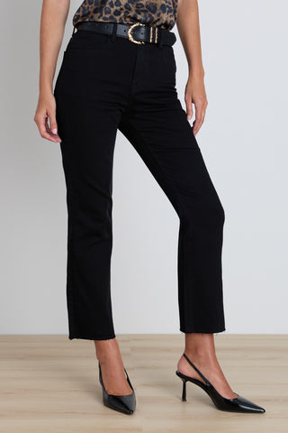 Detail of the Nicolette Cropped Jean in black showing the raw hem finish