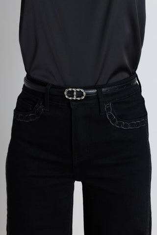 Detail of the Mabel Belt in black and silver showing the silver oval buckle