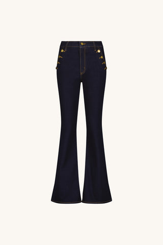 Flat lay of the Allegra Bootcut Jean in Indigo with gold button pocket details