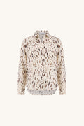 Ana Crepe Blouse in Lynx, flat lay. Cream button-front crepe blouse with espresso and taupe lynx print, shirt collar and long sleeves, The Noli Shop