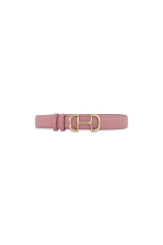 The Bettie Belt - Blush is a mauve pink pebbled faux leather belt with stitched edges and a gold-toned horsebit buckle, shown on a white background.