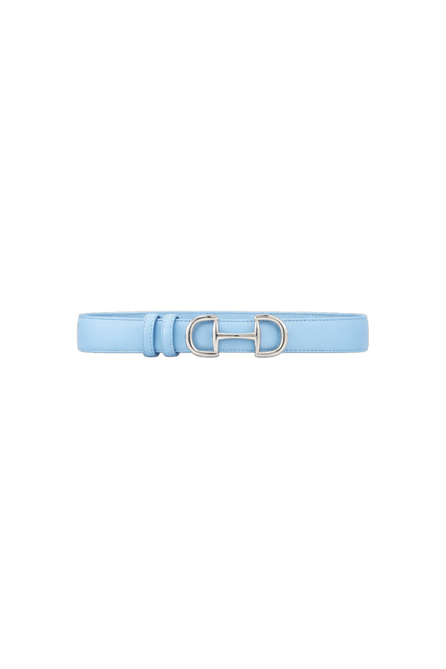 The Bettie Belt - Sky Blue is a light blue faux leather belt with a silver double ring buckle and subtle horsebit detail at the center. Simple and elegant, it's displayed against a white background.