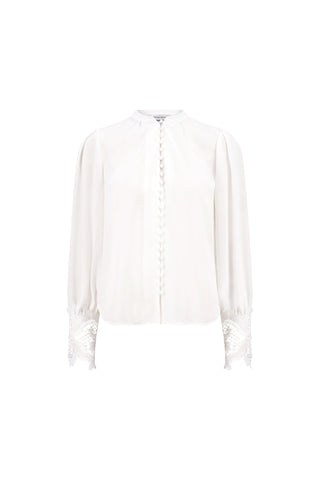 The Blake Lace Sleeve Blouse - White features a collarless high neckline, fabric-covered front buttons, loose lace-detailed sleeves, and lace trim at the cuffs for an elegant look.