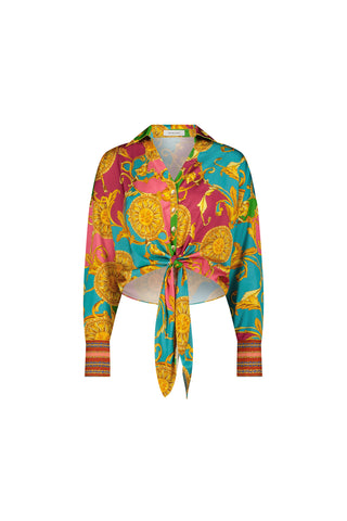 The Cecilia Silk Tie-Front Blouse - Dolce Sun features a colorful baroque-style print in teal, magenta, and yellow, with ornate patterns and a waist tie. This lightweight blouse adds flair to any outfit.