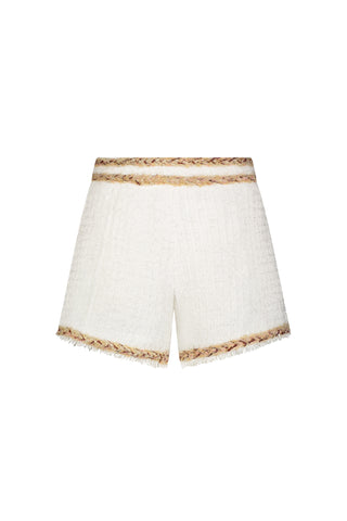 The Cheri Tweed Short in Pearl Multi features a white textured, high-waisted design with frayed hems and tan braided trim on the waistband and leg openings, shown against a plain white background.