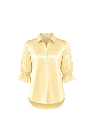 The Cindy Ruffle Sleeve Shirt in Sunshine Yellow features short satin puff sleeves with ruffled cuffs, a point collar, and a curved hem, shown on a white background.