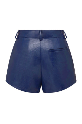 The Croco Faux Leather Short in Midnight Blue is perfect for spring. These shorts feature a sophisticated textured crocodile pattern and are designed to elongate your legs. They also come with belt loops and a convenient pocket on the back.